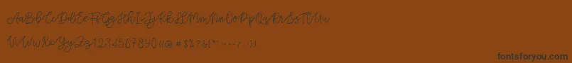 Cattomscute Font – Black Fonts on Brown Background