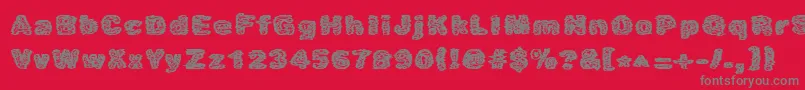 Czcionka Caustic – szare czcionki na czerwonym tle