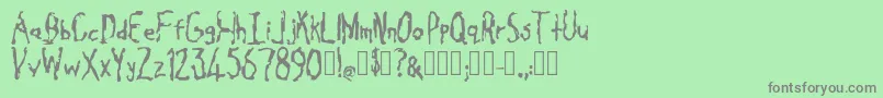 Cavity Regular-Schriftart – Graue Schriften auf grünem Hintergrund