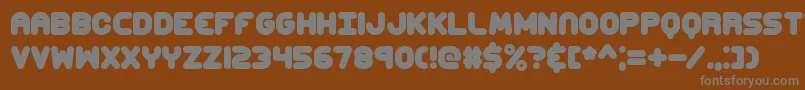 ccaps Font – Gray Fonts on Brown Background