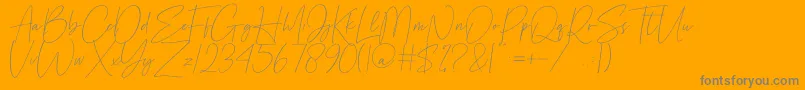 Cellestial-Schriftart – Graue Schriften auf orangefarbenem Hintergrund