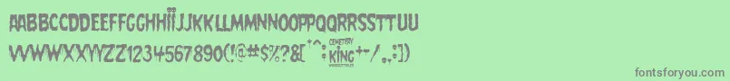 フォントCemetery King – 緑の背景に灰色の文字