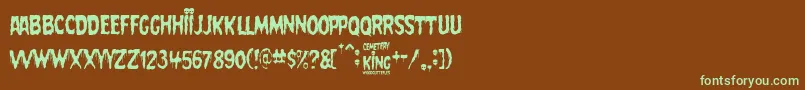 フォントCemetery King – 緑色の文字が茶色の背景にあります。