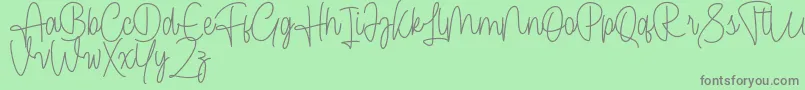 Cendolita Script Free Font – Gray Fonts on Green Background