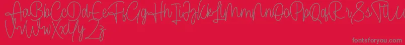 Cendolita Script Free-Schriftart – Graue Schriften auf rotem Hintergrund