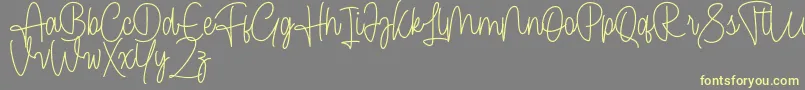 Cendolita Script Free Font – Yellow Fonts on Gray Background