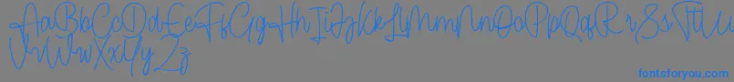 Czcionka Cendolita Script Free – niebieskie czcionki na szarym tle