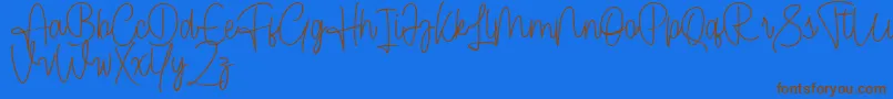 Cendolita Script Free-Schriftart – Braune Schriften auf blauem Hintergrund