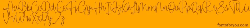 Cendolita Script Free Font – Brown Fonts on Orange Background