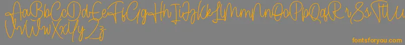 Cendolita Script Free Font – Orange Fonts on Gray Background