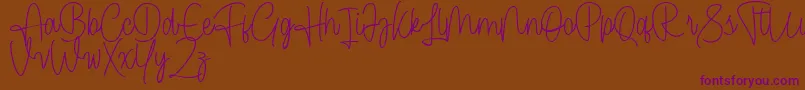 Cendolita Script Free Font – Purple Fonts on Brown Background
