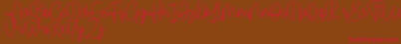 Czcionka Cendolita Script Free – czerwone czcionki na brązowym tle