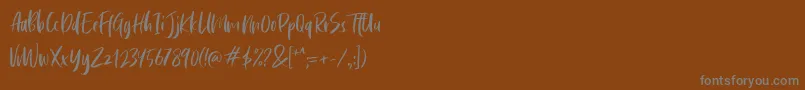 Cephalonia-Schriftart – Graue Schriften auf braunem Hintergrund