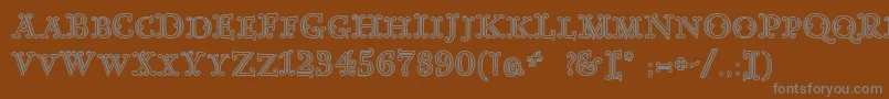 GoudyDecorInitialc-fontti – harmaat kirjasimet ruskealla taustalla