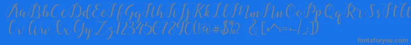 chalala-Schriftart – Graue Schriften auf blauem Hintergrund