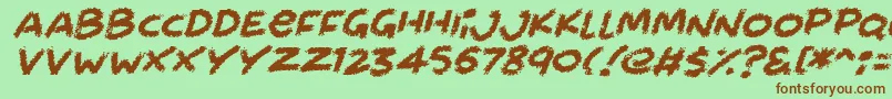 Fonte Chalkabout Italic – fontes marrons em um fundo verde