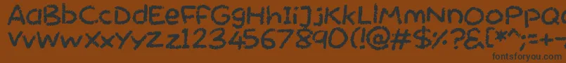 フォントChalktastic – 黒い文字が茶色の背景にあります