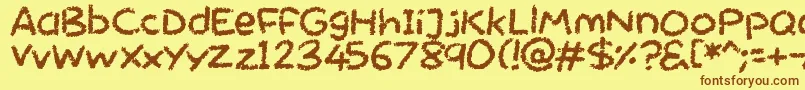 フォントChalktastic – 茶色の文字が黄色の背景にあります。