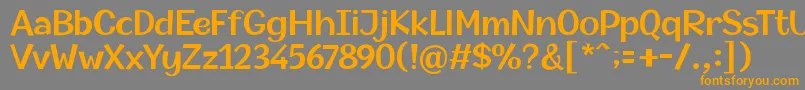 フォントChampigna SemiBold – オレンジの文字は灰色の背景にあります。
