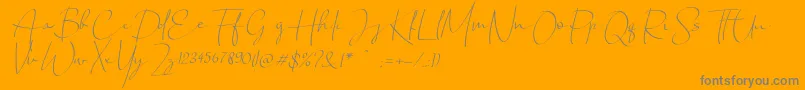 Chandrawinata italic-Schriftart – Graue Schriften auf orangefarbenem Hintergrund