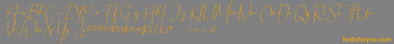 Шрифт Chandrawinata italic – оранжевые шрифты на сером фоне