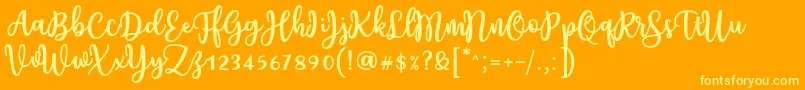 Czcionka Charilla Font by Situjuh 7NTypes – żółte czcionki na pomarańczowym tle
