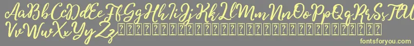 Charitta Font – Yellow Fonts on Gray Background