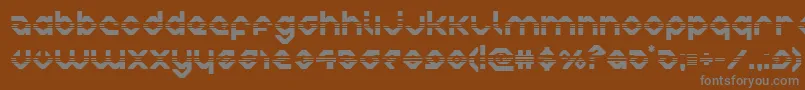 charliesangleshalf-fontti – harmaat kirjasimet ruskealla taustalla