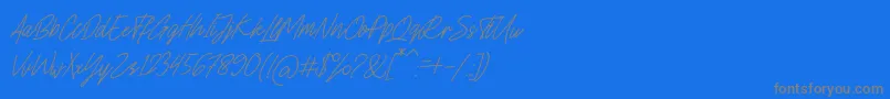 フォントCharlion Slant Script – 青い背景に灰色の文字