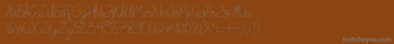 More about Chattagirie Font Chattagirie Font – Gray Fonts on Brown Background