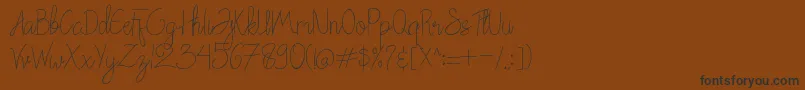 Chattagirie Font – Black Fonts on Brown Background