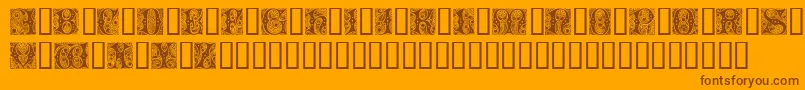 Cheshire Initials-fontti – ruskeat fontit oranssilla taustalla