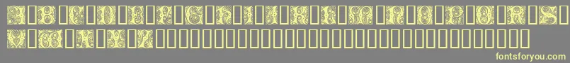 Czcionka Cheshire Initials – żółte czcionki na szarym tle