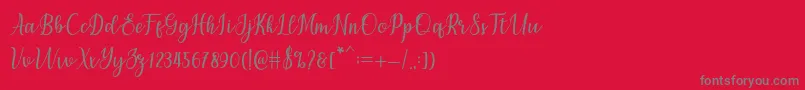 フォントchetlie – 赤い背景に灰色の文字