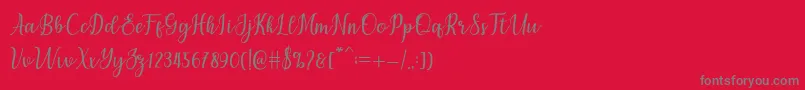 フォントchetlie – 赤い背景に灰色の文字