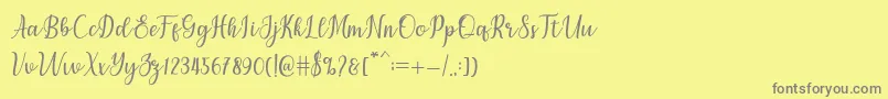 フォントchetlie – 黄色の背景に灰色の文字