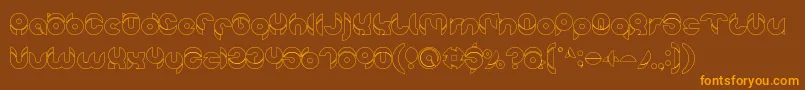 chewedkandi outline-Schriftart – Orangefarbene Schriften auf braunem Hintergrund