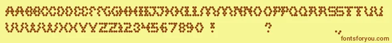 Hexagonal-Schriftart – Braune Schriften auf gelbem Hintergrund