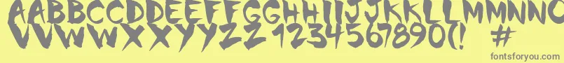 フォントChinela Brush – 黄色の背景に灰色の文字