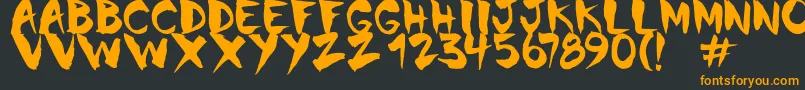 フォントChinela Brush – 黒い背景にオレンジの文字