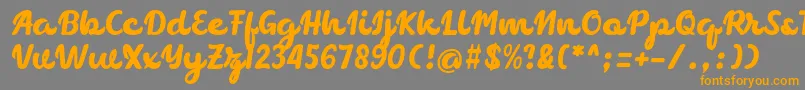 フォントchocolate – オレンジの文字は灰色の背景にあります。