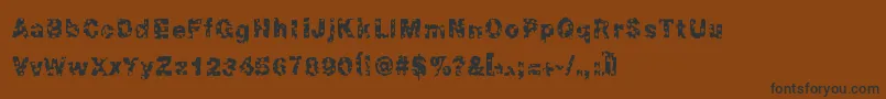 フォントChonky – 黒い文字が茶色の背景にあります