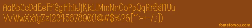 フォントChopyor – オレンジ色の文字が茶色の背景にあります。