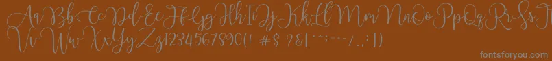 Chourush-fontti – harmaat kirjasimet ruskealla taustalla