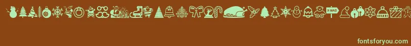 フォントChristmas Icons – 緑色の文字が茶色の背景にあります。