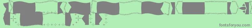 Więcej informacji o czcionce ChristmasBanner PERSONAL Czcionka ChristmasBanner PERSONAL – szare czcionki na zielonym tle