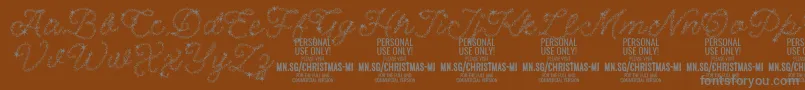 フォントChristmasMiracle PERSONAL – 茶色の背景に灰色の文字