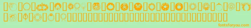 ChristmasWreath-Schriftart – Orangefarbene Schriften auf grünem Hintergrund