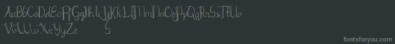 フォントChrisyard – 黒い背景に灰色の文字