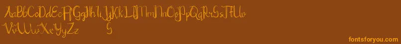 Chrisyard-Schriftart – Orangefarbene Schriften auf braunem Hintergrund